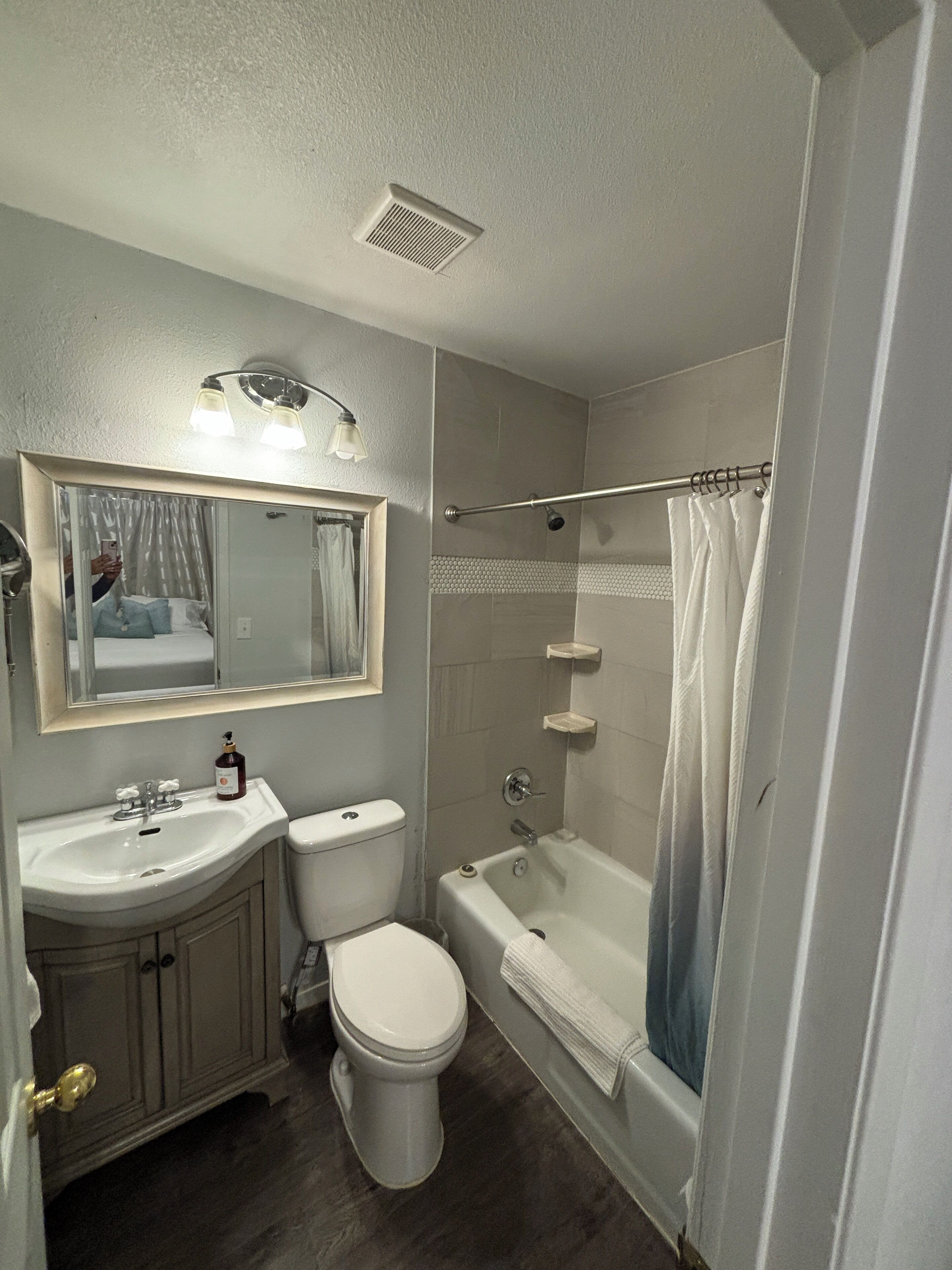 Combined shower/tub, hair dryer, towels, soap