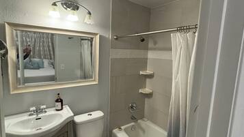 Combined shower/tub, hair dryer, towels, soap