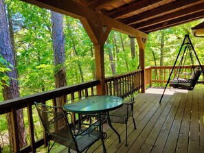 Outdoor dining - Tranquil Cabin- Perched on Mountain Top boasting jacuzzi for two and expansive deck with views! Trail & Cave on Property! (Eureka Springs)