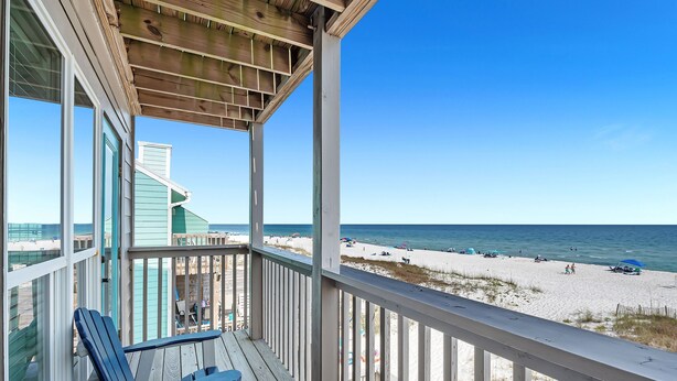 A wooden deck with two blue chairs, a view of the beach, and a clear blue sky. - 🥳 Early Bird Sale! 🥰 Beach Axis, East. 5BR Beachfront Beauty. Pool. Perfect location. (Gulf Shores)