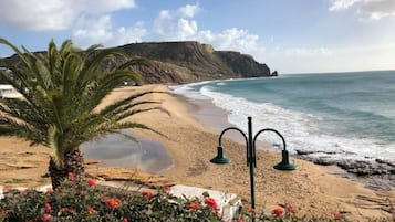 On the beach, sun-loungers, beach towels
