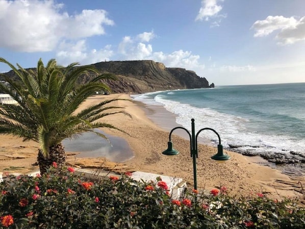 On the beach, sun-loungers, beach towels