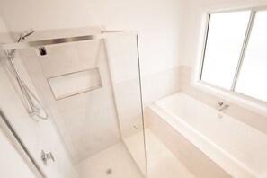 Bathtub, hair dryer, towels