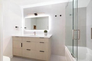 Shower, hair dryer, towels, shampoo