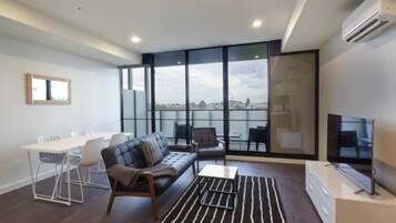 Premier Apartment, 1 Bedroom | Living area | Flat-screen TV