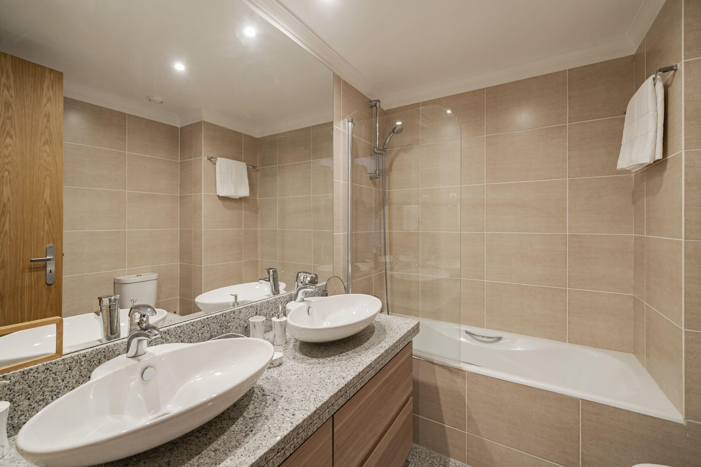 Bathtub, hair dryer, towels