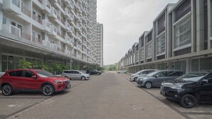 A multi-story residential building with a central courtyard. - RedDoorz Apartment @ Sentul Tower (Citaringgul)
