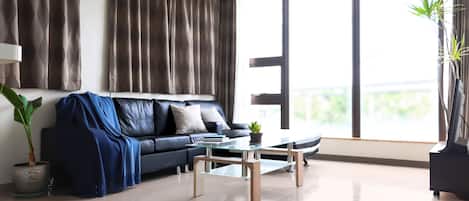 Apartment, 2 Bedrooms (A) | Living area | LCD TV, toys