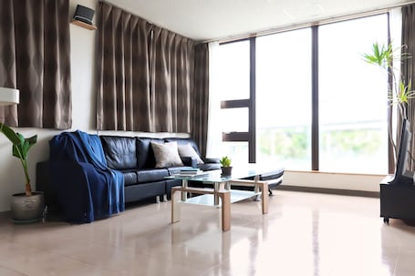 Apartment, 2 Bedrooms (A) | Living area | LCD TV, toys