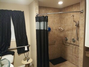 Bathtub, towels, toilet paper