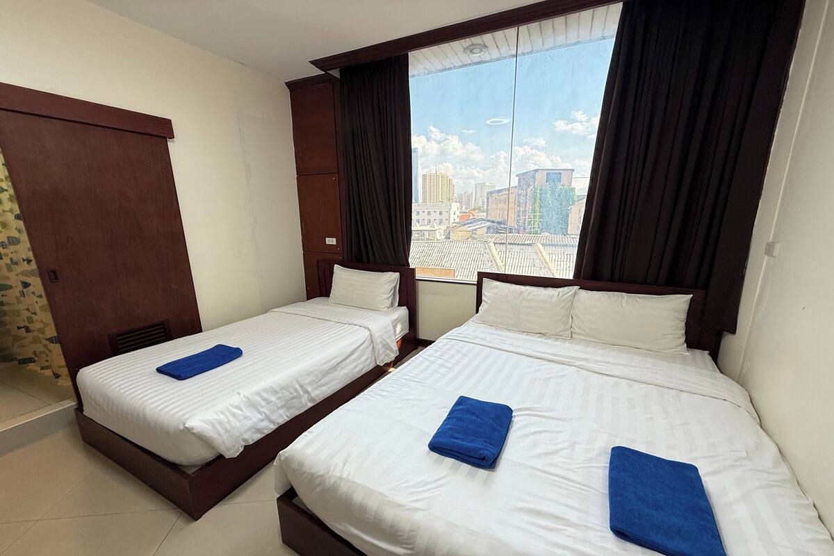 Family Room, City View | Blackout curtains, free WiFi, bed sheets