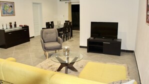 Comfort Apartment, 2 Bedrooms | Living area | 32-inch plasma TV with satellite channels, TV - Guest House De Treichville (Abidjan)