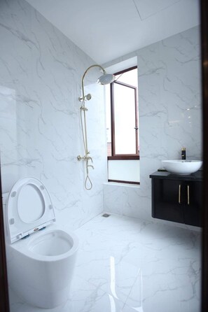 Shower, free toiletries, hair dryer, slippers