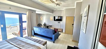 Deluxe Double Room | Living area | 32-inch LED TV with satellite channels, TV