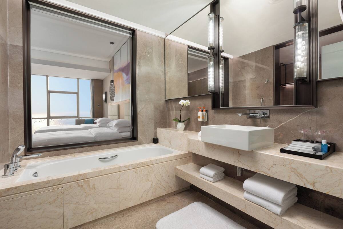 Separate bathtub and shower, rainfall showerhead, free toiletries