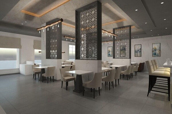 Un restaurant moderne doté de hauts plafonds, d’un éclairage suspendu et d’un design minimaliste.