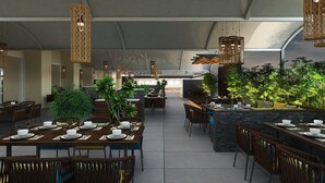 A restaurant with multiple dining tables and chairs, hanging wicker chandeliers, and potted plants. - Enrise by Sayaji Rau (Indore)