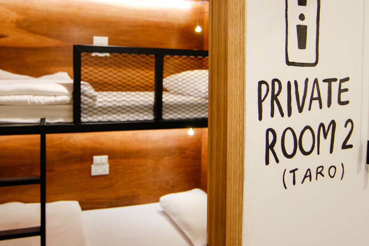 A private room with bunk beds and a bed, labeled "PRIVATE ROOM 2 (TARO)".
