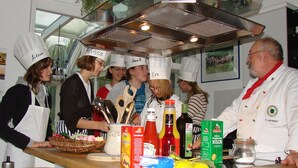 A kitchen counter with various food items and cooking utensils. - Vacation apartment at Wulfkamp (Velen)