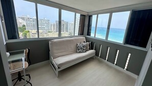 Living area - Beach front, best location, ocean and city views + parking! (San Juan)