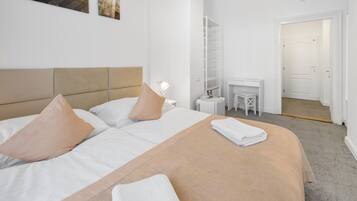 Triple Room with balcony | Desk, laptop workspace, blackout curtains, iron/ironing board