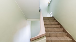 Stairs lead to a window at the top, offering a view.