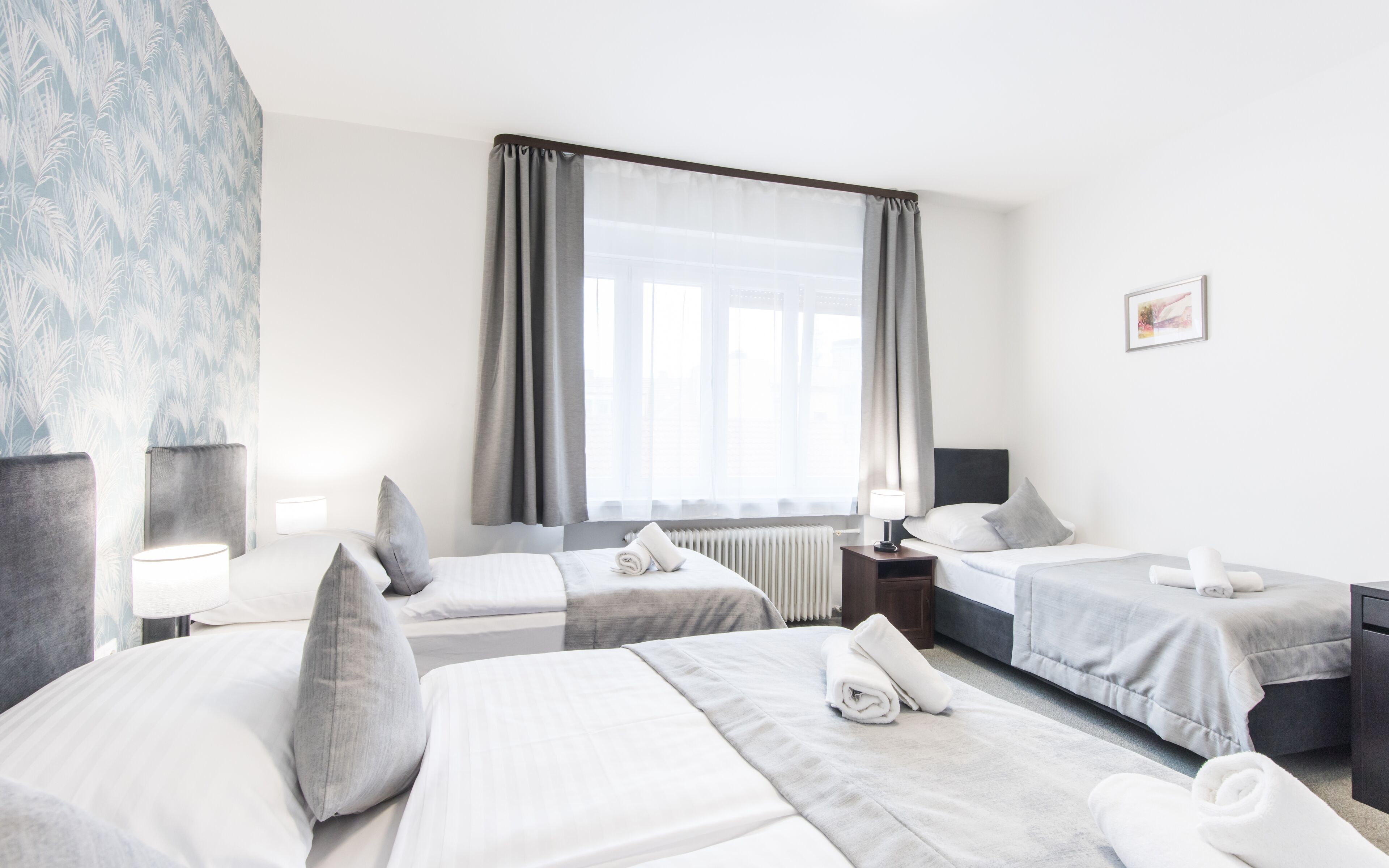 Comfort Quadruple Room | Desk, laptop workspace, blackout drapes, iron/ironing board