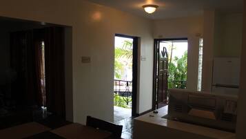 Deluxe Apartment, 2 Bedrooms, Garden View | Private kitchen | Fridge, microwave, oven, high chair