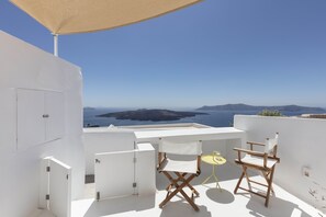 Relax on the serene outdoor terrace with breathtaking sea views and a peaceful atmosphere.