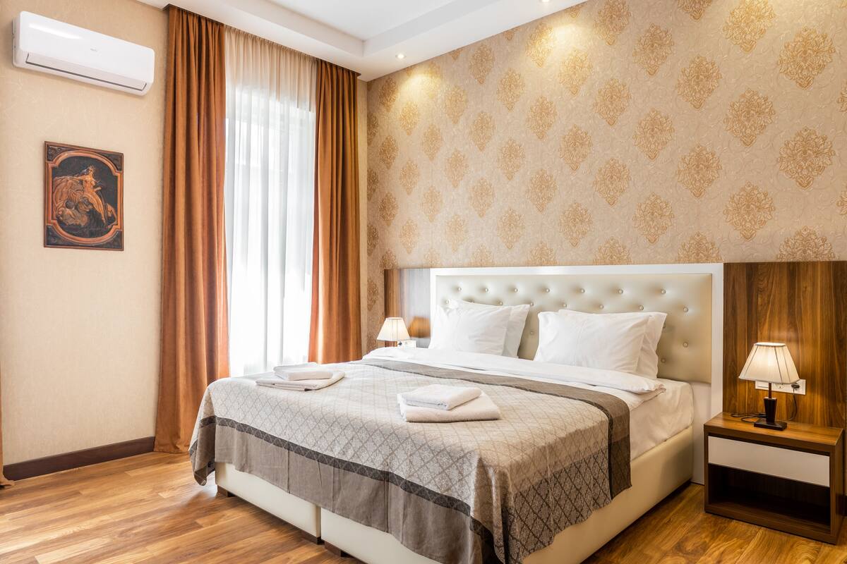 Deluxe Double or Twin Room | Living area | TV