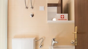 A bathroom with a toilet, bidet, sink, and a trash bin. - Apartments Dia - Studio Apartment with Terrace (Dubrovnik)