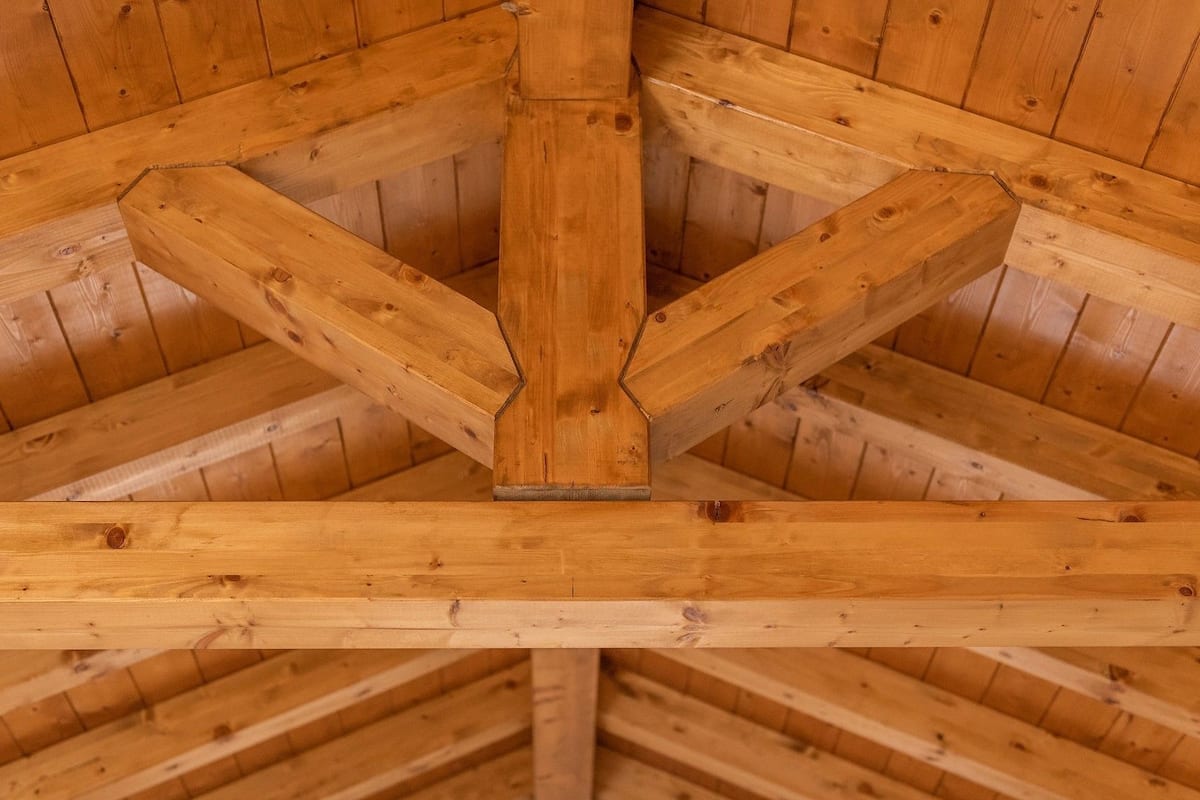 A wooden truss structure in a building's attic.