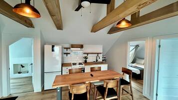 Appartement Signature | Repas dans la chambre