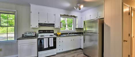 Fridge, microwave, stovetop, coffee/tea maker