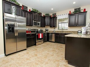 Fridge, microwave, oven, stovetop - 6BR 6BA Pool Home In ChampionsGate (Davenport)