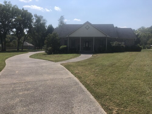 Family style one level home with a modern flair on a one acre lot.
