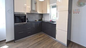 Apartment (Maisonette B6) | Private kitchen | Coffee/tea maker, full-sized fridge, oven, stovetop - Apartments Medna (Dobrinj)
