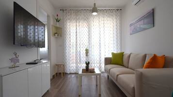 Apartment, 2 Bedrooms (B2) | Living area | Flat-screen TV