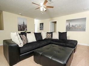 House | Living room | TV, video-game console, DVD player, foosball - 6BR 6BA Pool Home In Champions Gate (Davenport)