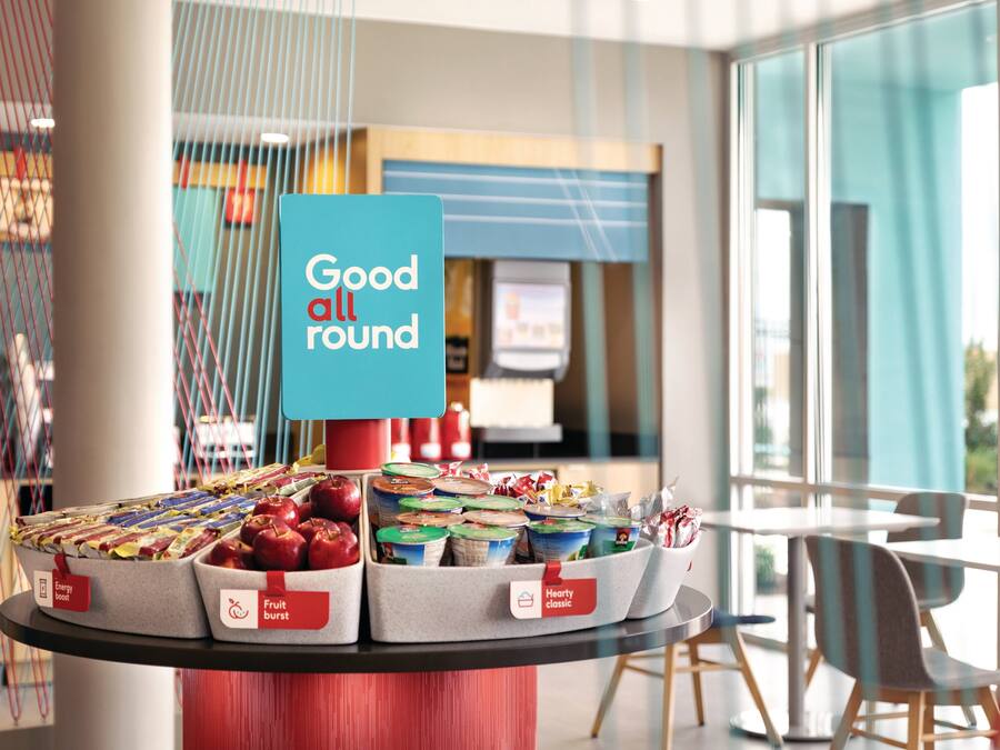 A display of packaged food items with labels such as "Energy Boost" and "Fruit Burst" in a modern, well-lit indoor setting.