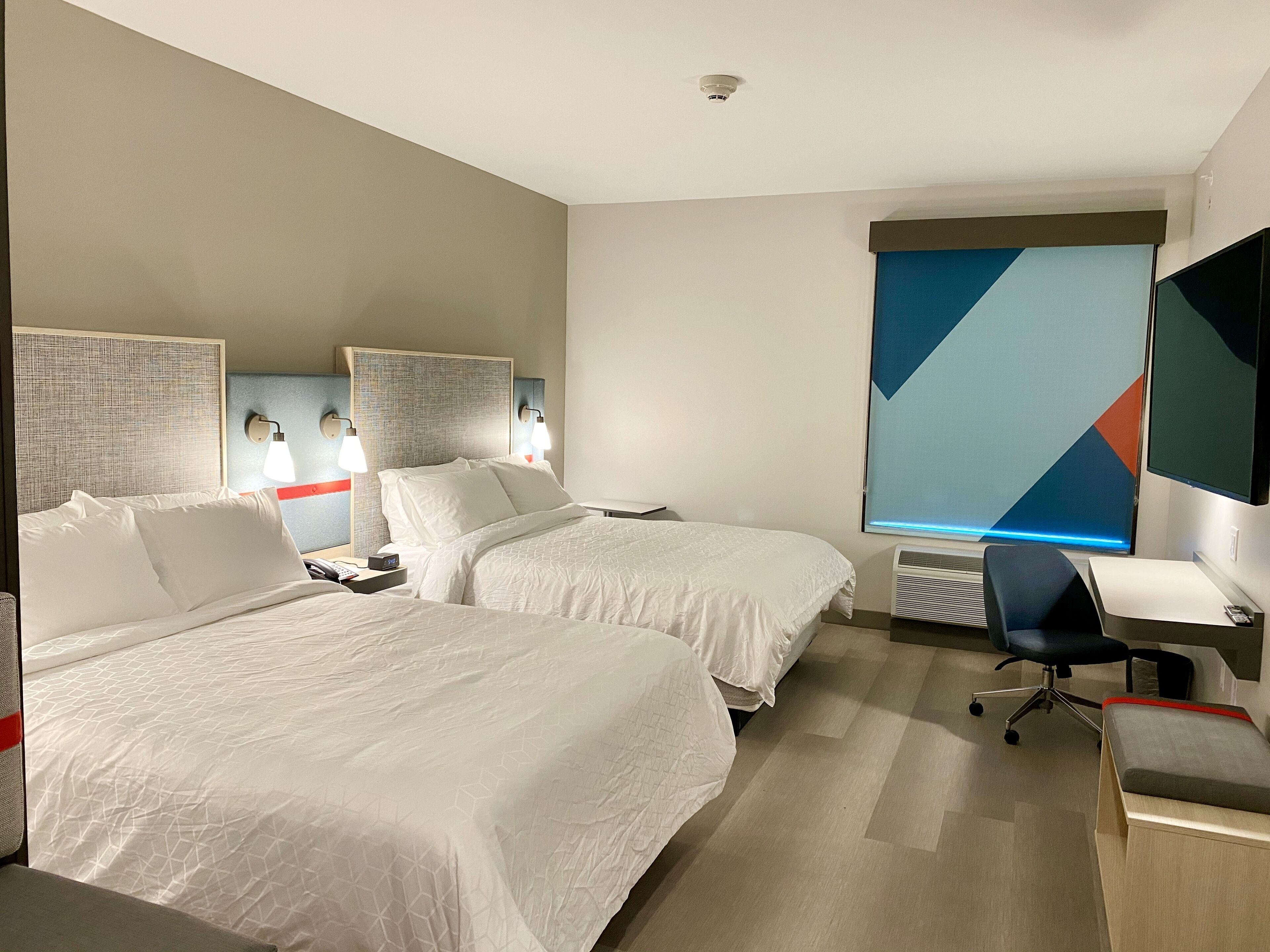 pillow-top beds, laptop workspace, blackout curtains, soundproofing