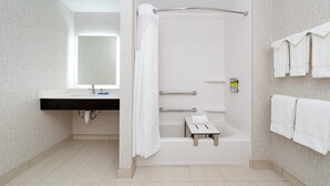 A modern bathroom with a shower, a sink, and a mirror. - Holiday Inn Express & Suites Romeoville - Joliet North by IHG (Romeoville)