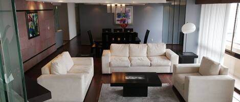 Panoramic Apartment, 3 Bedrooms, City View | Living room | Flat-screen TV