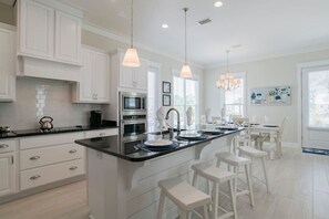 Fridge, coffee/tea maker, cookware/dishes/utensils