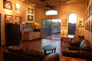 Living room and kitchenette with microwave, airfryer, toaster oven, & BBQ stove.