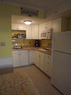 Fridge, microwave, stovetop, coffee/tea maker