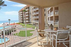 Outdoor dining - Location, location, location. Keep a close eye on the kids pool side, from this 2nd floor 2/2 condo (New Smyrna Beach)