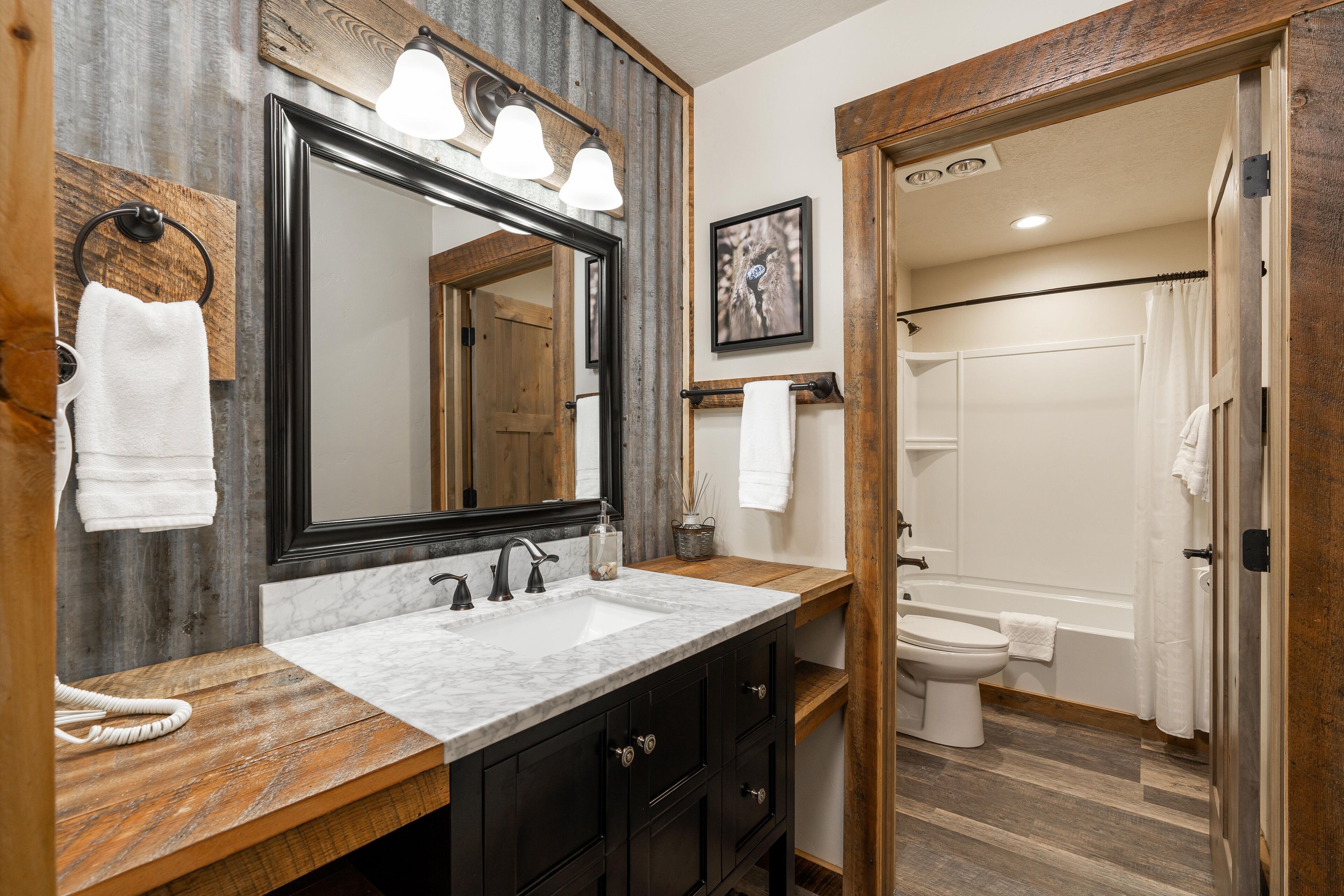 the hilgard | bathroom | combined shower/bathtub, hair dryer, towels, soap