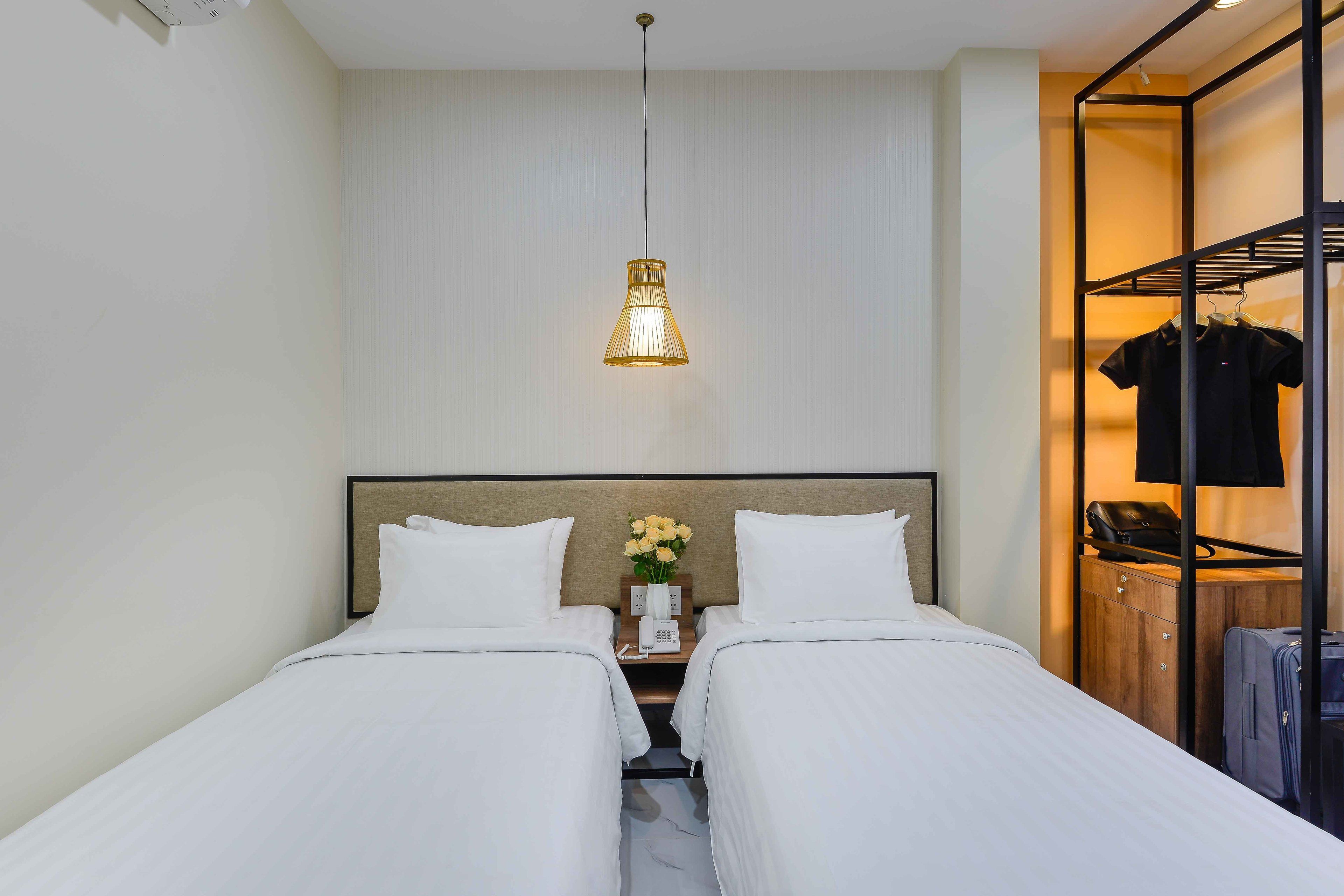 deluxe twin room | premium bedding, in-room safe, laptop workspace, blackout curtains