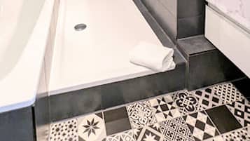 Bathtub, hair dryer, towels, soap